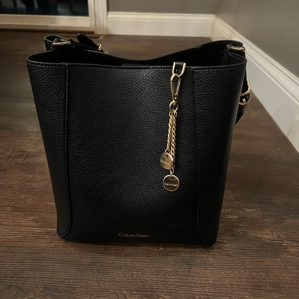 Black leather Calvin Klein handbag. Excellent condition. 25” deep 24” wide.